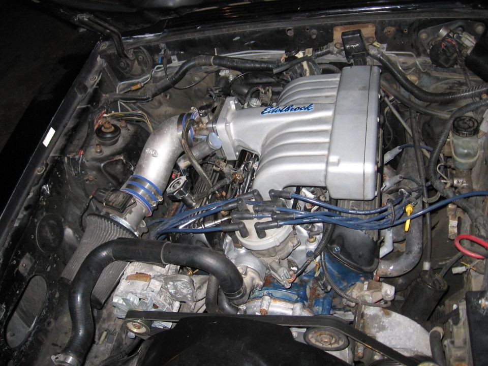 Engine bay with an Edelbrock intake manifold installed