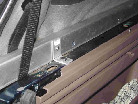 1993 Ford Bronco - I bent 90 degree brackets out of aluminum bar to mount the shortened tonneau cover bed rails to the original hardtop mounting holes.