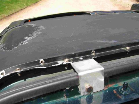 1993 Ford Bronco - Here is the mount on the driver's side of the top. For now I simply have small bolts attaching the cab channel to the aluminum brackets. I…