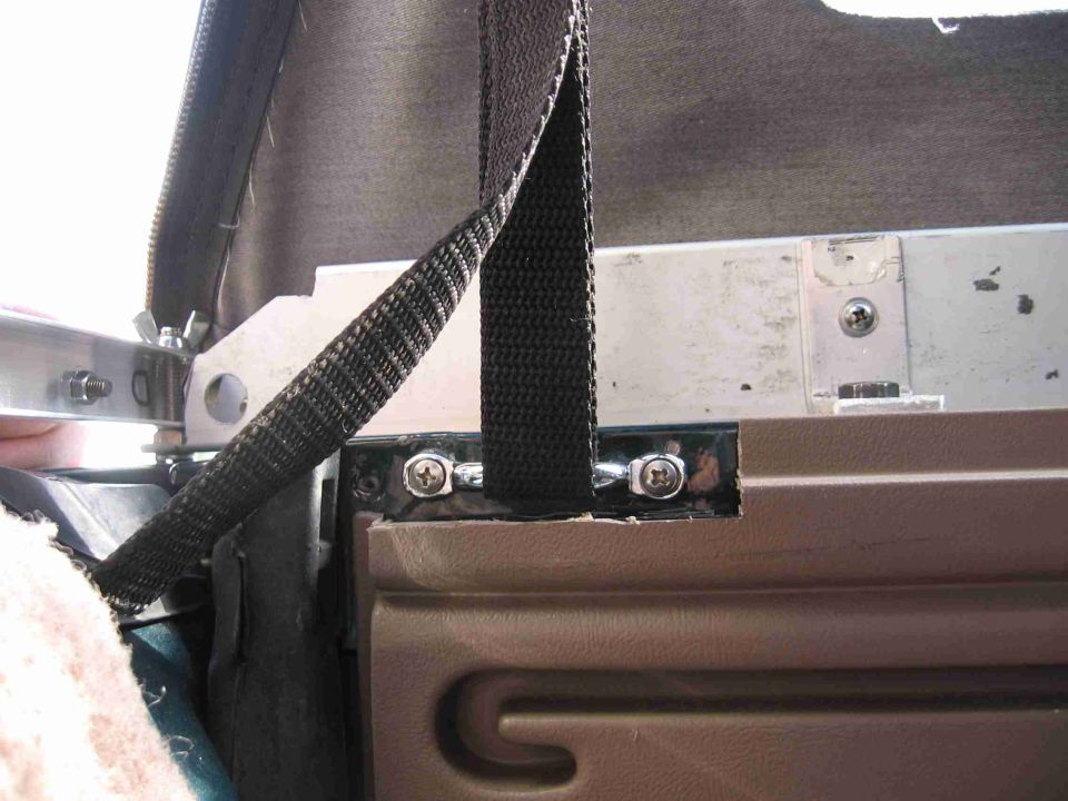 I mounted the footman's loops on the inside of the bedsides instead of the top. I did this partially because of a lack of space on the top of the bedside, but also so that I will not have to remove the footman's loops when I switch back to the hardtop in the fall. I had to cut a portion of the interior trim panel away in order to make room for the loop, I used a dremel and a sharp knife to do this.