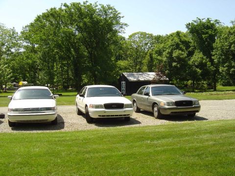 2001 Ford Crown Victoria - The Colonel's '95 and '99 P71, and my '01.