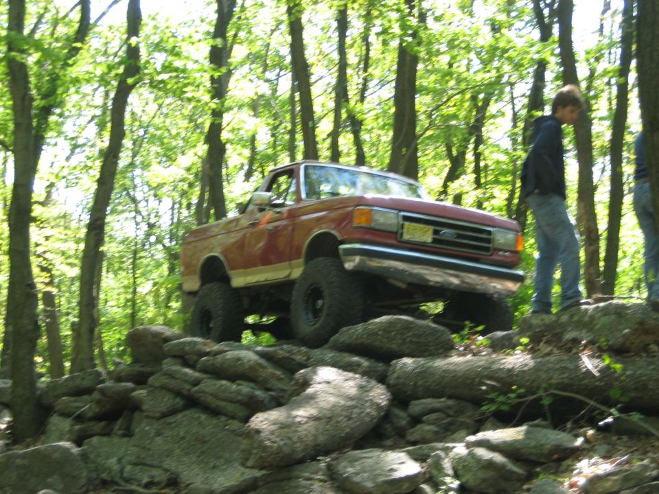 1990 Ford Bronco 3q-front view on rocky terrain