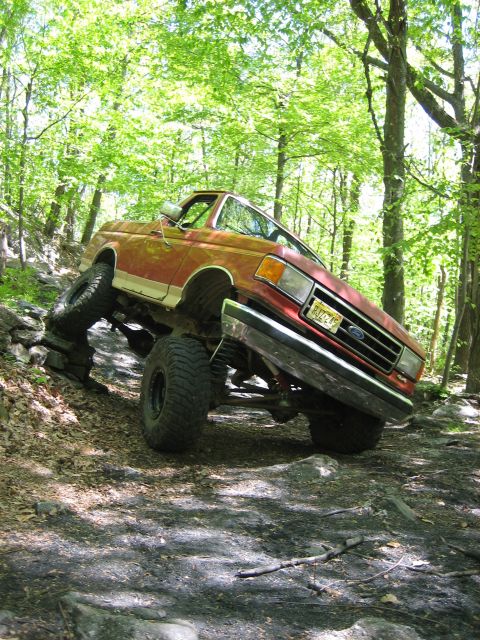 1990 Ford Bronco - This 1990 Ford Bronco navigates a rocky trail, its off-road capabilities.