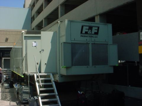 2000 Ford Taurus - Mobile production trailer with F&F Productions LLC branding and exterior access stairs.