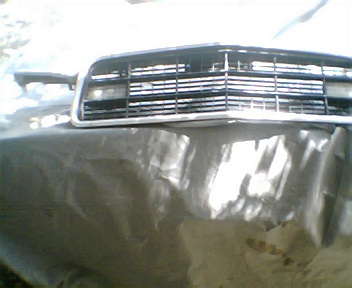 1973 Ford Ranchero - Close-up of the front grille and hood of a 1973 Ford Ranchero.