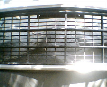 1973 Ford Ranchero - Close-up of a vehicle's front grille, showing its grid pattern.