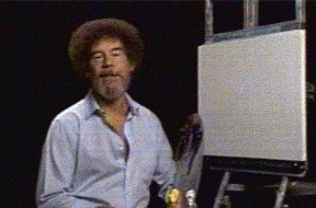 1987 Suzuki Samurai - Bob Ross, the host of The Joy of Painting, stands ready to paint on a blank canvas.