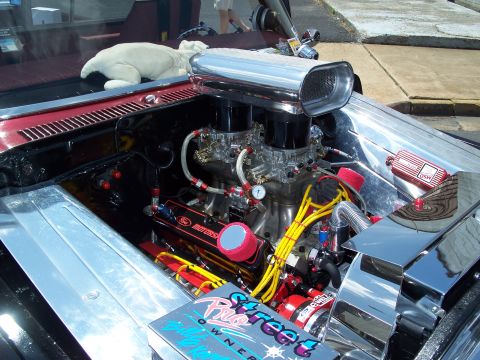 1971 Ford Ranchero - Customized engine bay dual carburetors, a prominent chrome air scoop, and a 'Pro Street Owner' decal.
