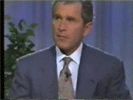 1987 Suzuki Samurai - George W. Bush is seen in a formal suit and tie against a blue backdrop.