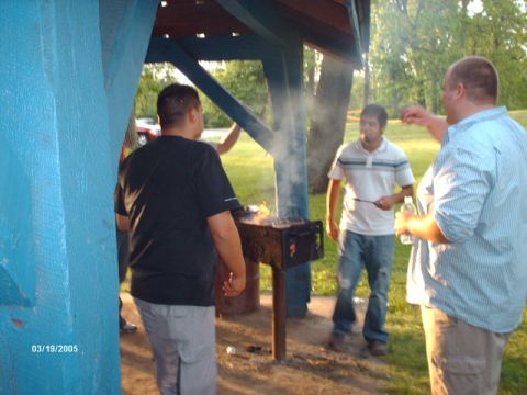 1995 Ford Probe - A red car is visible in the background of a gathering at a picnic shelter.