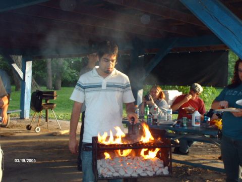 1995 Ford Probe - A group of people enjoy a barbecue under a shelter, with a date stamp indicating the event occurred on March 19, 2005.