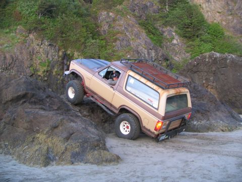 1983 Ford Bronco - Ford Bronco tackles a challenging rocky terrain on the coast.