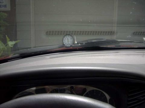 1997 Ford Taurus - A close-up view of a gauge mounted on the dashboard of a vehicle.