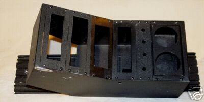 2003 Ford Crown Victoria - This is a center console part with various openings for components.