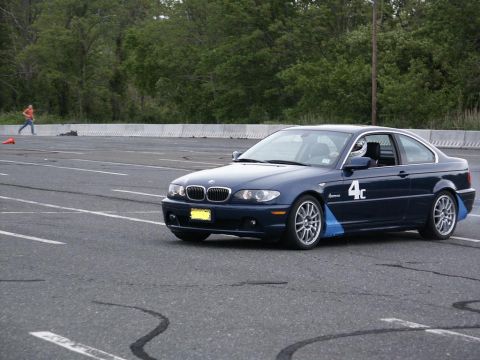 2001 Mercury Grand Marquis - A dark blue BMW 3 Series coupe participates in an autocross event.