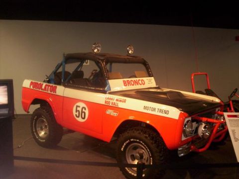 1989 Ford Bronco - This 1989 Ford Bronco features racing decals and a roll cage, suggesting a history in off-road competition.