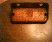 1972 Ford Ranchero - Amber marker light assembly, likely for a vehicle, shown close-up.