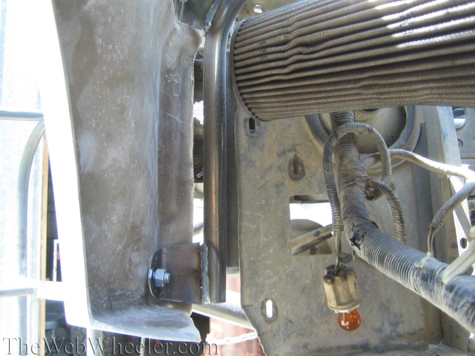 Front frame and bumper bracket detail with radiator and wiring