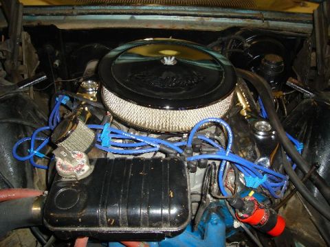 1962 Ford Thunderbird - Close-up view of a vehicle's engine bay, showing various components and wiring.