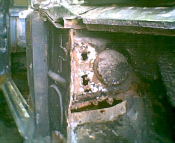 1973 Ford Ranchero - Close-up of severe rust damage on a vehicle's front end, including the Supermotors logo.