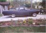 1973 Ford Ranchero - Side view of a dark pickup truck. The vehicle does not appear to be a 1973 Ford Ranchero.