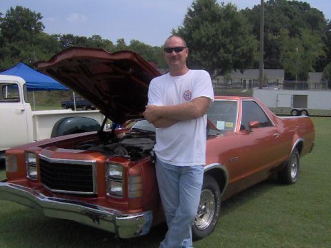 1979 Ford Ranchero - A man poses with a copper 1978 Ford Ranchero at an outdoor event.