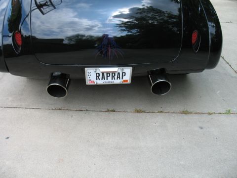 1940 Chevrolet Suburban - The rear of a custom vehicle shows off its dual exhaust and a personalized license plate.
