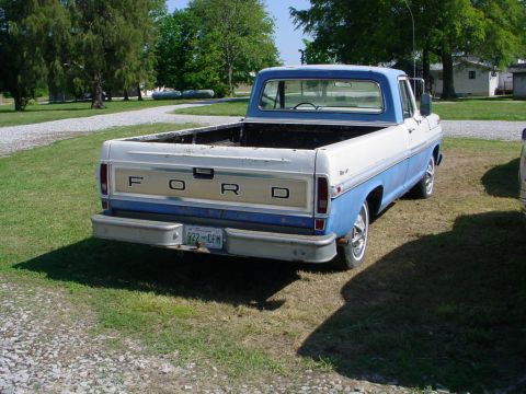 1972 Ford Ranchero - This pickup truck features a blue and white two-tone paint scheme and "FORD" lettering on the tailgate.