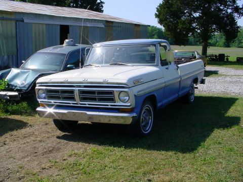 1972 Ford Ranchero - Ford F-Series pickup truck from the early 1970s parked in a grassy yard.