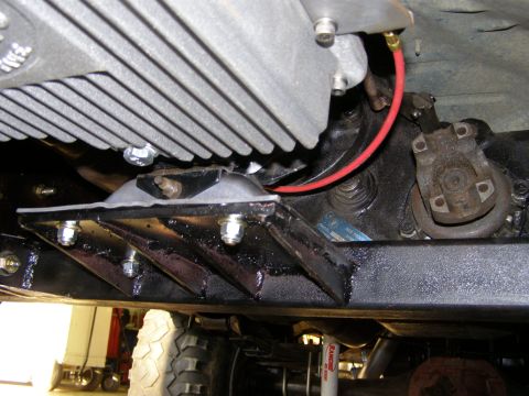 1993 Ford Bronco - Close-up view of the underside of a vehicle, focusing on mechanical parts and suspension parts.