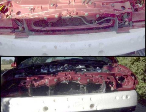 1997 Ford Taurus - Front view of a car's engine compartment and bumper, with the hood open.