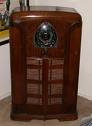 1971 Ford Ranchero - A vintage wooden radio sits on a pedestal, displaying intricate details and a central emblem.