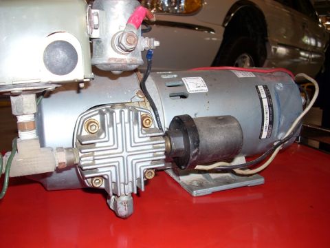 1992 Ford Bronco - Close-up view of an air compressor motor, showing its various components and wiring.