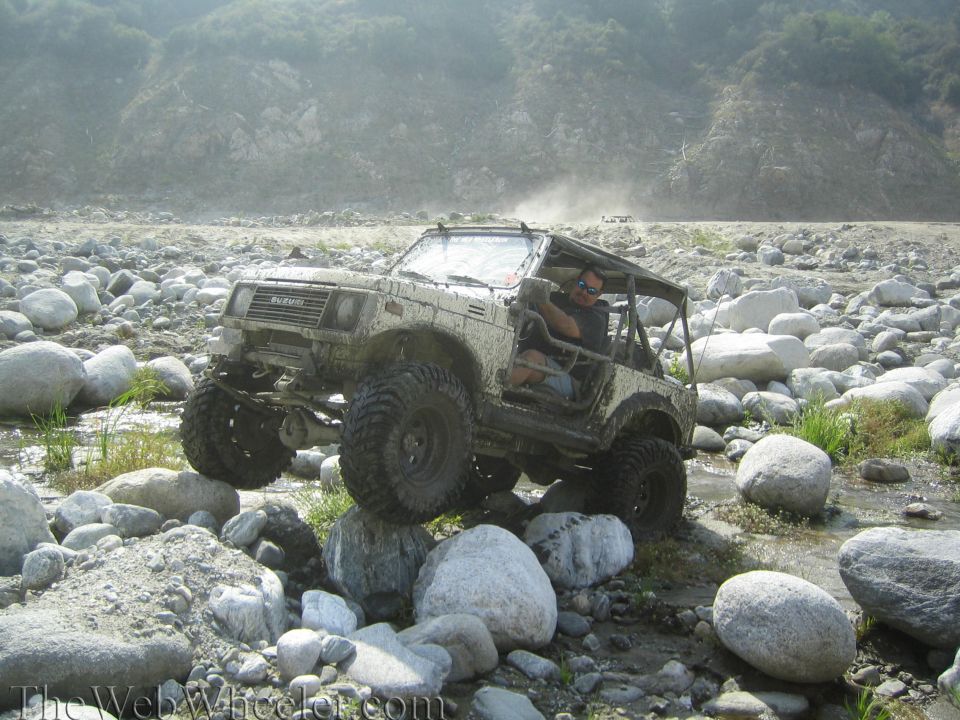 1987 Suzuki Samurai navigating rocky terrain