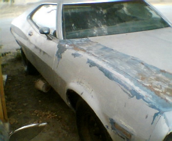 1973 Ford Ranchero - A white 1972 Ford Ranchero shows signs of repair work on its front end.