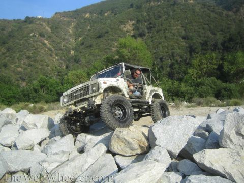 1987 Suzuki Samurai - A modified 1987 Suzuki Samurai navigates a rocky terrain, its off-road capabilities.
