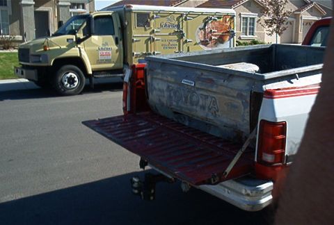 1982 Toyota 4Runner - This pickup truck features a red and white exterior and a weathered tailgate with 'Toyota' branding visible.