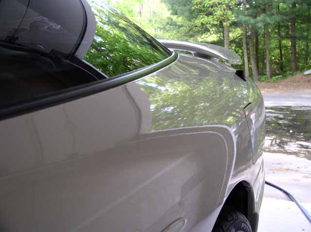 Silver 1996 Ford Probe GT rear quarter panel with a spoiler and tinted window
