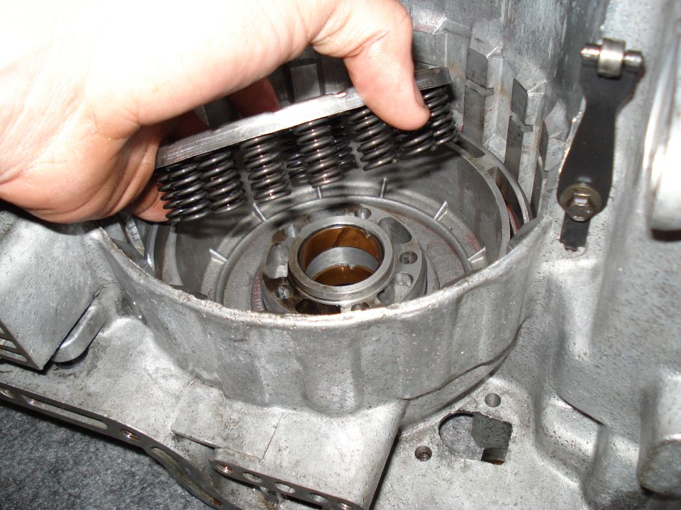 Hand holding springs during transmission rebuild