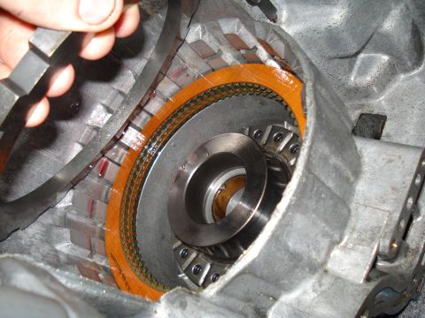 1984 Ford Bronco - Close-up view of a transmission's internal components, showing clutch plates and a torque converter.