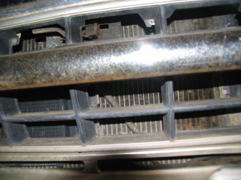 1978 Ford Bronco - Close-up of the front grille and radiator on a 1978 Ford Bronco.