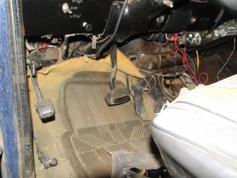 1978 Ford Bronco - The driver's side footwell and dashboard reveal exposed wiring and a multi-position switch.