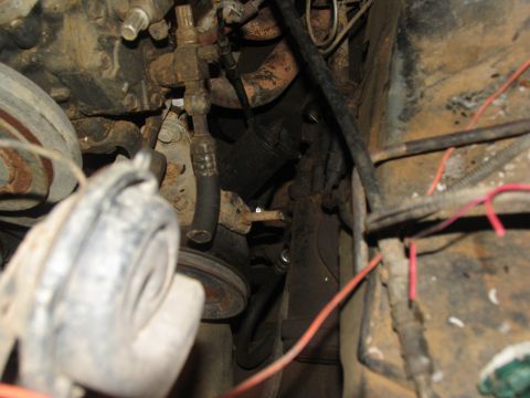 1978 Ford Bronco - Close-up view of engine bay components, showing rust and wiring.