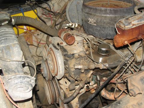 1978 Ford Bronco - The engine bay shows a K&N air filter and various engine components, including belts and hoses.