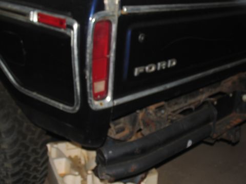 1978 Ford Bronco - The rear of a black 1978 Ford Bronco shows its iconic taillight and "FORD" badging.