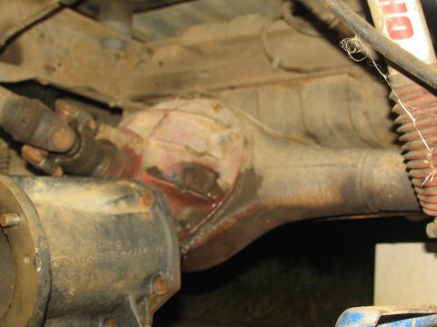 1978 Ford Bronco - Underside view of a vehicle's rear axle assembly, showing the driveshaft and differential housing.