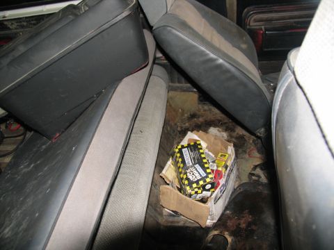 1978 Ford Bronco - The interior of a vehicle shows worn seats and a box of Rock Auto parts on the floor, suggesting a project vehicle.