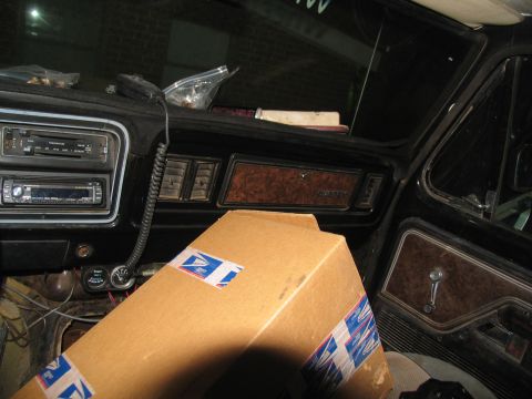 1978 Ford Bronco - The interior of a 1978 Ford Bronco, with a cardboard box obscuring part of the dashboard and passenger seat.