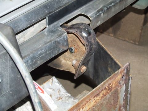 1979 Ford Bronco - Close-up view of a winch bumper mounting bracket, showing bolts and signs of rust.