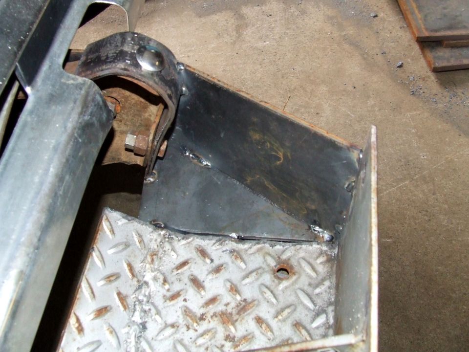 Close-up of custom winch bumper fabrication with diamond plate and welded steel